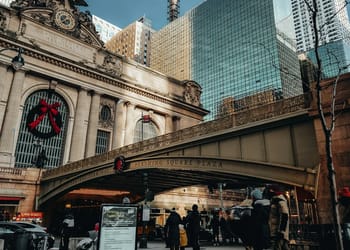 a group of people walking near Grand Central Terminal during winter