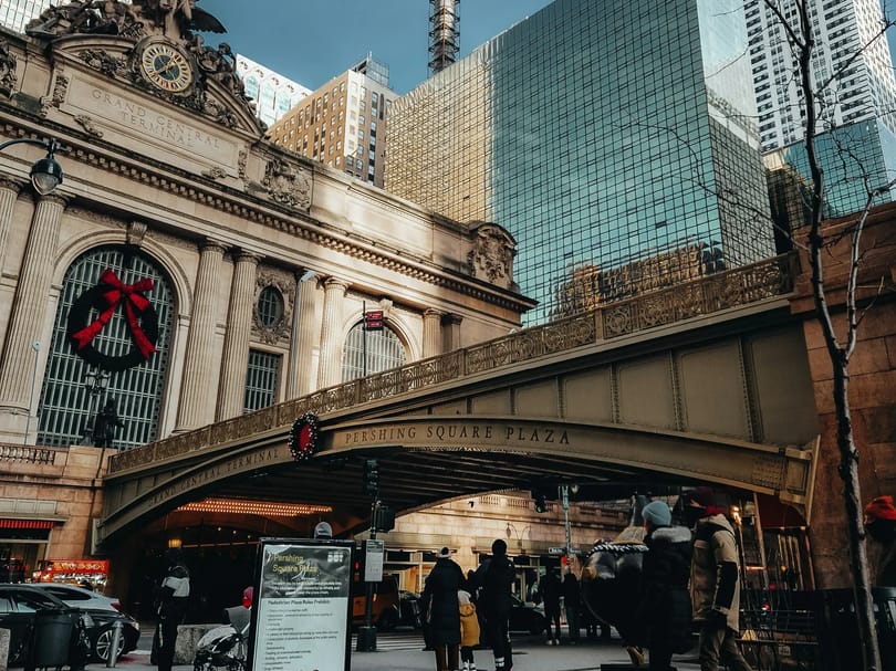 a group of people walking near Grand Central Terminal during winter