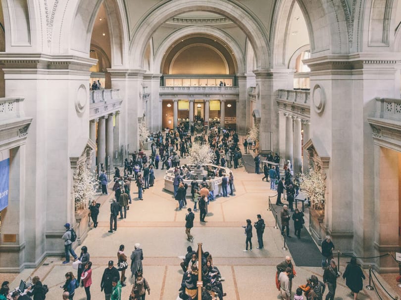People walking through the Met in NYC
