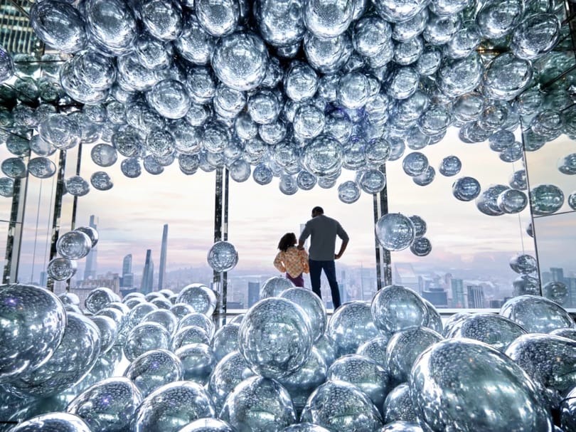 Father and daughter at the art installation inside SUMMIT One Vanderbilt NYC