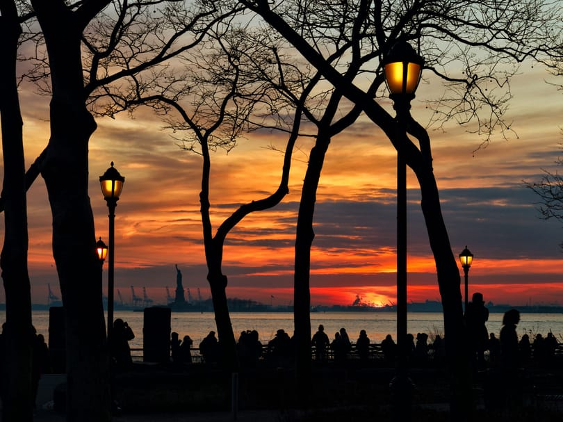 Sunset at Battery Park with view of the Statue of Liberty