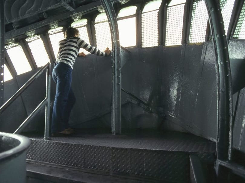 Visitor looking through the windows inside the Statue of Liberty crown